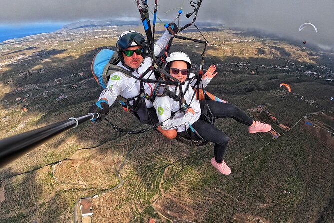 BRONZE tandem paragliding flight in South Tenerife, free pick up - In the air over Costa Adeje: thermal hunting and real commentary