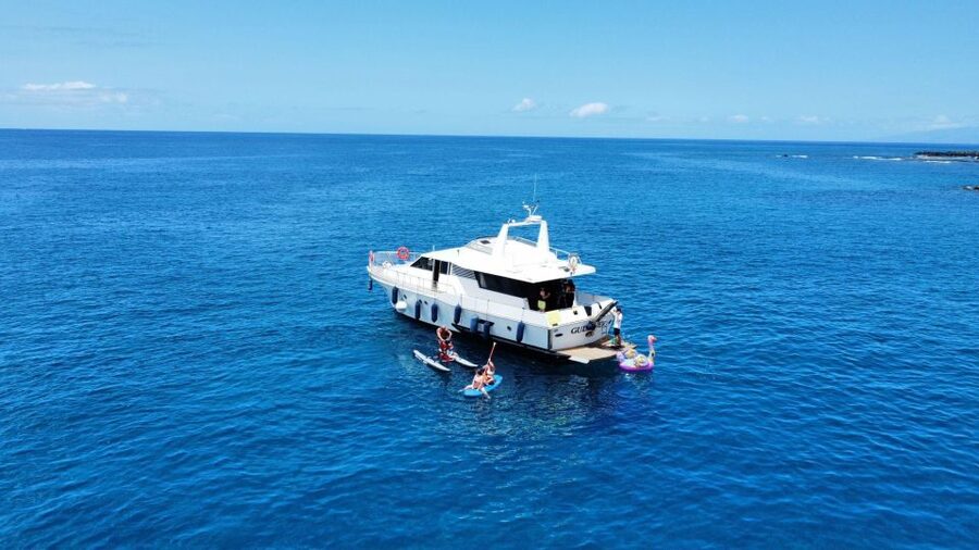 Costa Adeje: Private Yacht Trip with Watersports and Slides - Gulliver Fun Yacht, Puerto Colón start, and what the day feels like