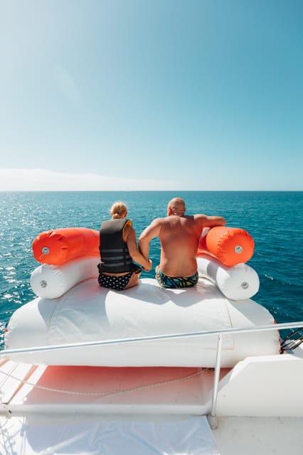 Costa Adeje: Private Yacht Trip with Watersports and Slides - What happens during the cruise: stops around PalmMar and Playa de las Vistas