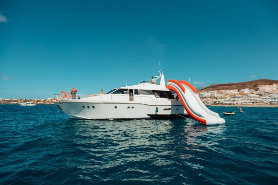 Costa Adeje: Private Yacht Trip with Watersports and Slides - Waterslide and underwater scooter: where the smiles usually start