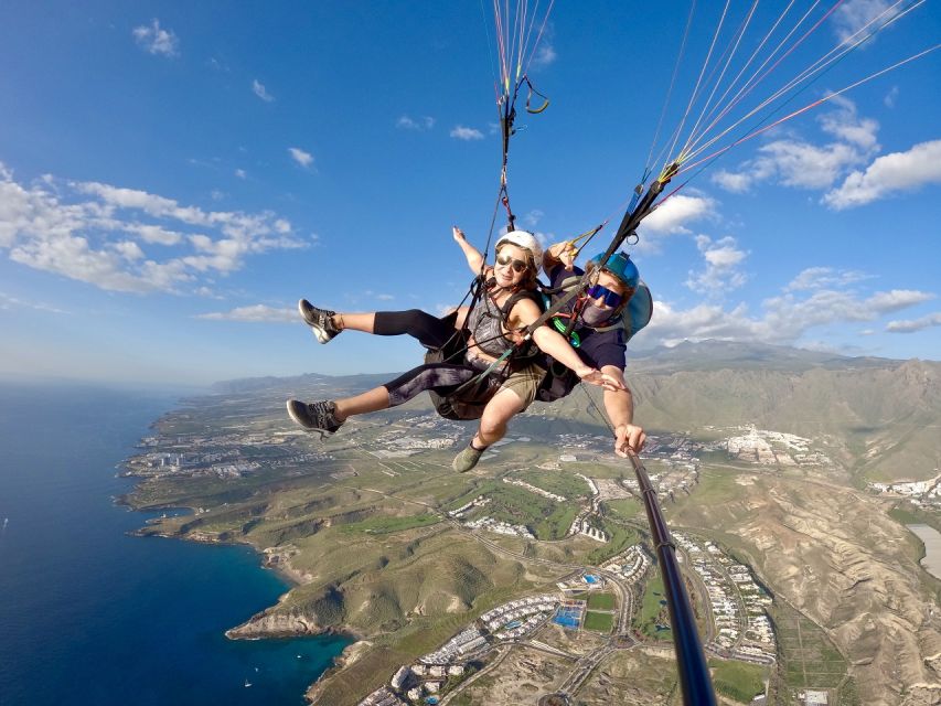 Costa Adeje: Tandem Paragliding Flight with Pickup - Gear Setup: Helmet, Kneepads, and an Emergency Parachute