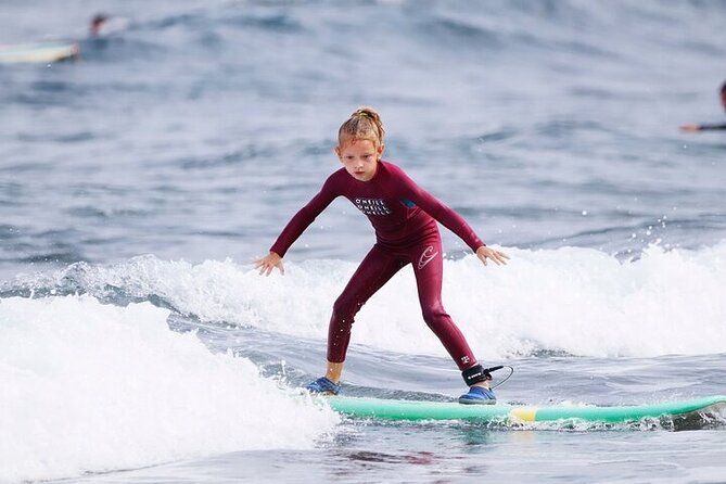 Group Surf Class in Playa de Las Américas with Photographs - Warm-Up and Into the Water: From Sitting to Standing