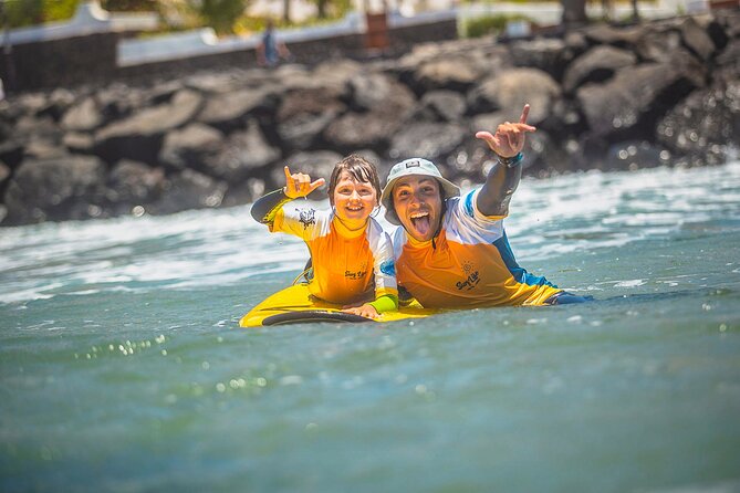 Private Family Surf Lesson - How the lesson works in the water: flippers, board control, and level matching