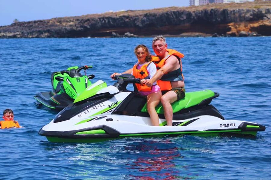 Puerto Colón: Kawasaki Jet Ski Tour Along Tenerife's Coast - Speedboat Back: Wrapping Up in One Piece