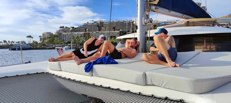 Tenerife: PRIVATE Catamaran cruise with Lunch and Drinks - The anchored swimming block: clear water, toys, and real relaxation