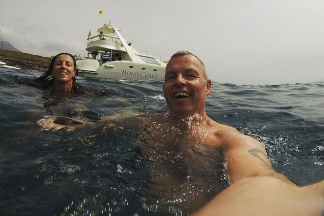 Whale Watching Catamaran Cruise with Transfer, Buffet by MC - Finding pilot whales and dolphins: what to watch for on deck